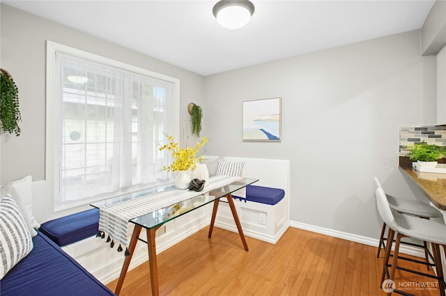 office featuring baseboards and light wood-type flooring