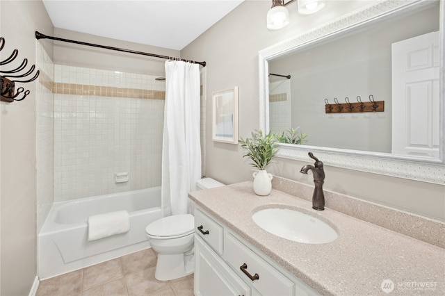 bathroom featuring tile patterned floors, vanity, toilet, and shower / bath combo with shower curtain