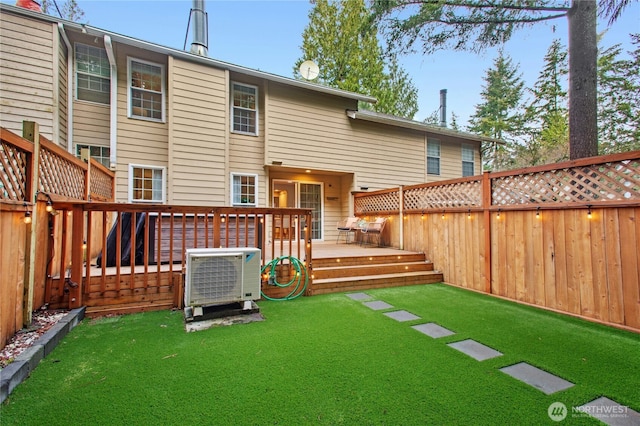 back of property featuring ac unit, a deck, and a fenced backyard