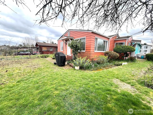 view of property exterior featuring a lawn