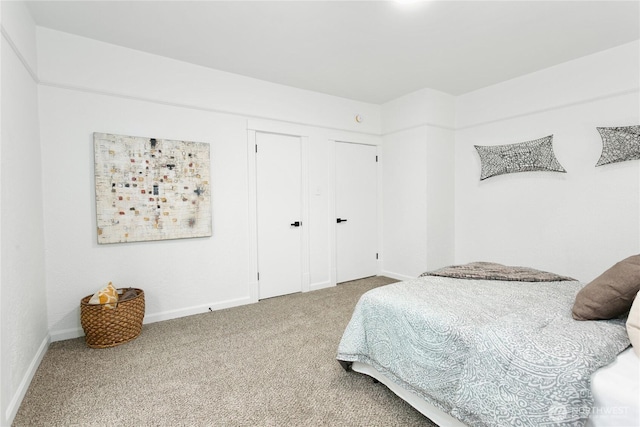 carpeted bedroom with baseboards