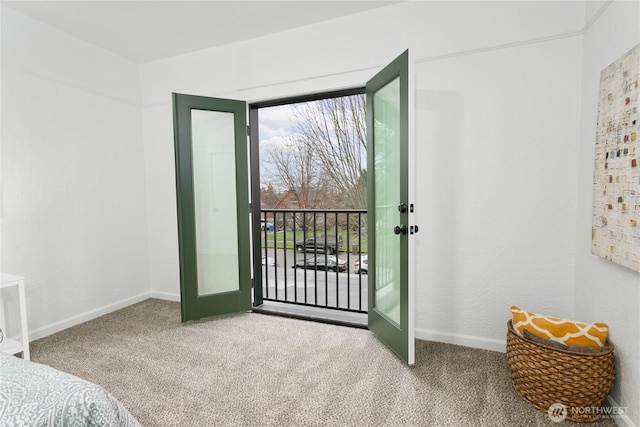 carpeted bedroom featuring multiple windows, french doors, and baseboards