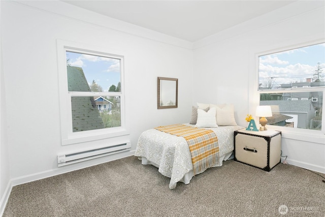 carpeted bedroom with multiple windows, baseboards, and a baseboard radiator