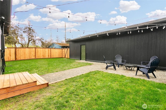 view of yard with a patio and a fenced backyard