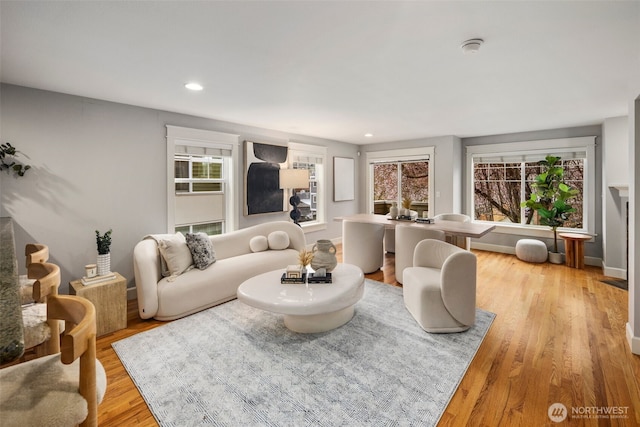 living area featuring recessed lighting and light wood-type flooring