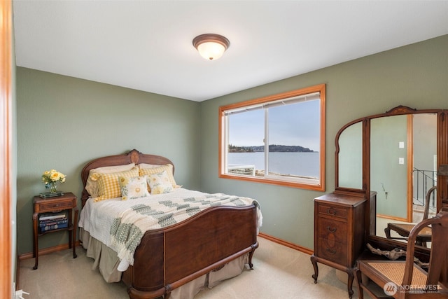 carpeted bedroom with baseboards