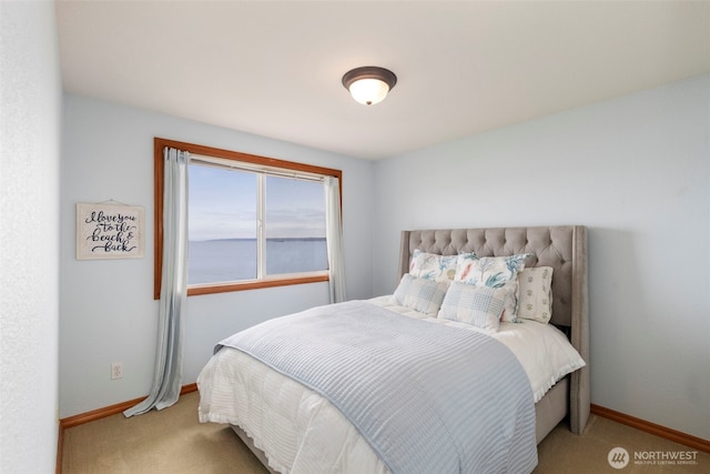 bedroom with carpet and baseboards