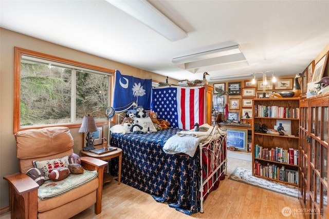 bedroom with wood finished floors