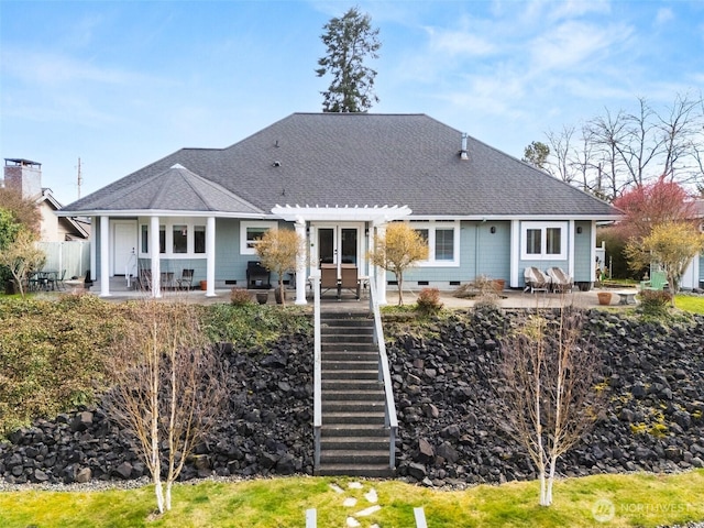 back of house featuring crawl space, a shingled roof, french doors, and a patio area