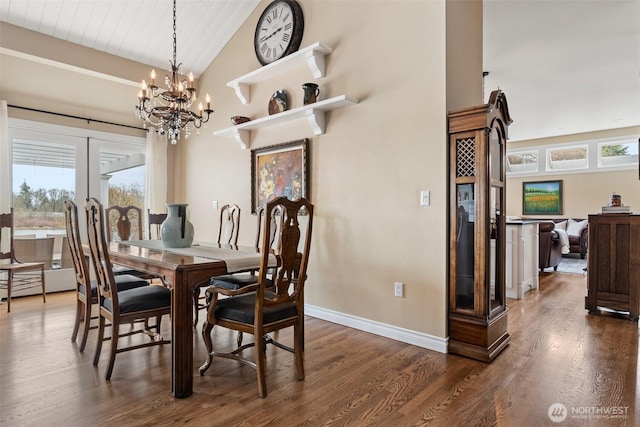 dining area with dark wood-type flooring, baseboards, wooden ceiling, a notable chandelier, and high vaulted ceiling