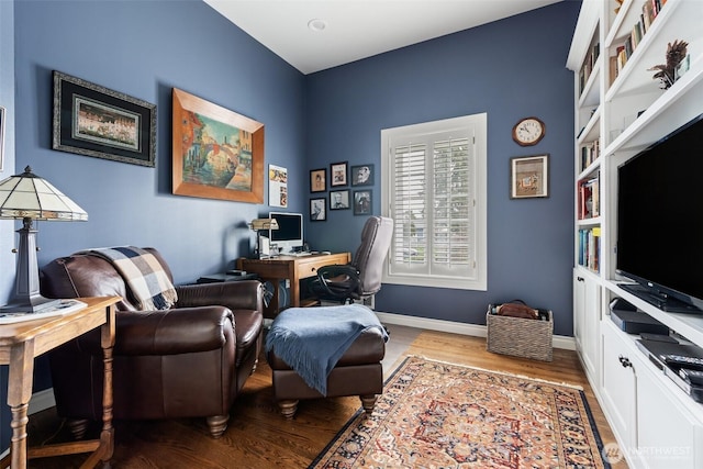 home office with wood finished floors and baseboards