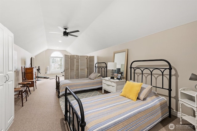 carpeted bedroom featuring vaulted ceiling, a ceiling fan, and baseboards