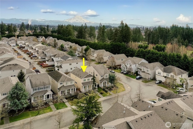 birds eye view of property featuring a mountain view and a residential view