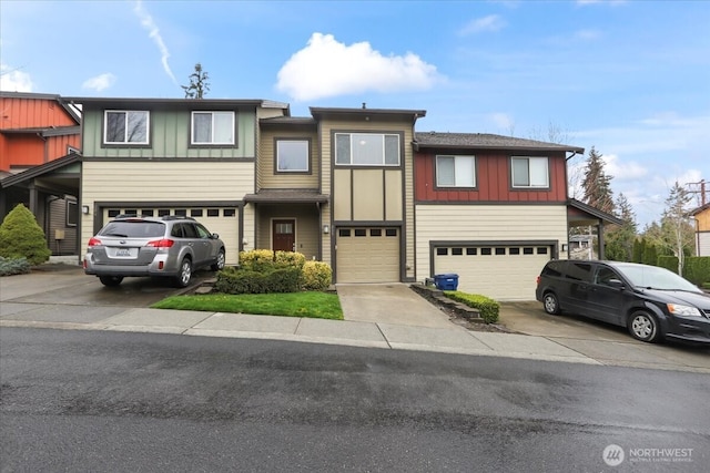 view of front of house featuring board and batten siding, concrete driveway, and a garage