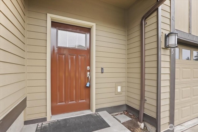 property entrance with a garage