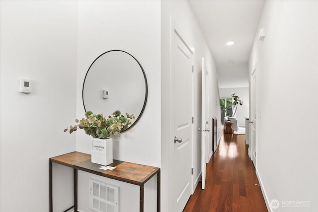 hallway featuring recessed lighting, baseboards, and wood finished floors