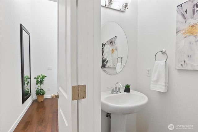 bathroom featuring wood finished floors and baseboards