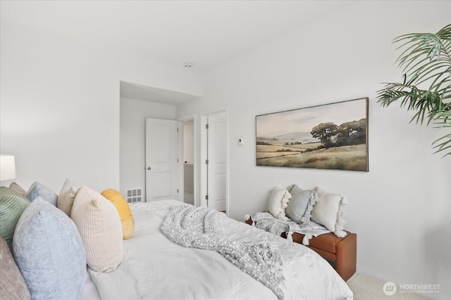 bedroom featuring visible vents and carpet