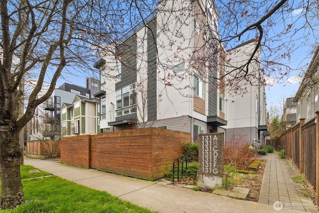 exterior space with fence private yard and brick siding