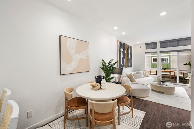 dining area featuring recessed lighting, baseboards, and wood finished floors