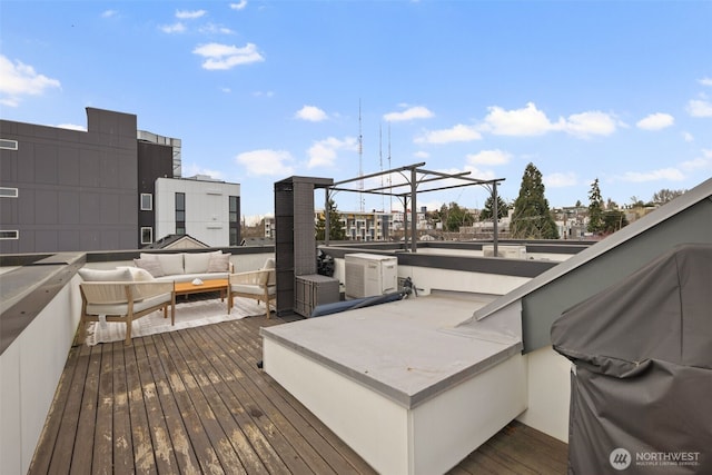 wooden deck with outdoor lounge area