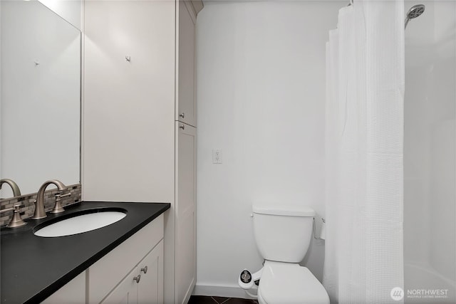 bathroom with toilet and vanity