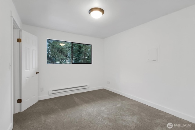 carpeted empty room featuring a baseboard radiator and baseboards