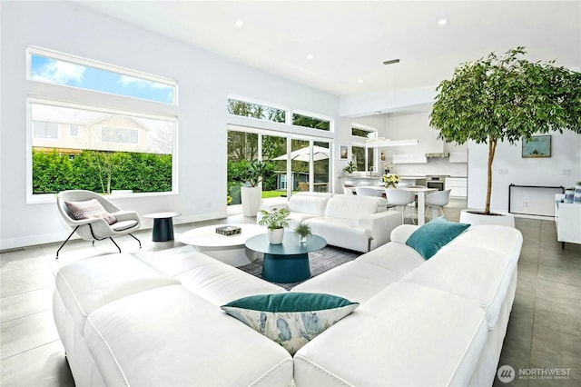 living area with plenty of natural light and recessed lighting