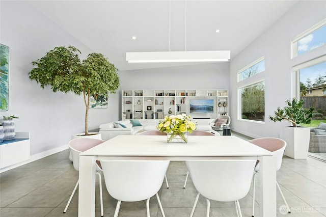 dining area with light tile patterned floors, recessed lighting, and baseboards