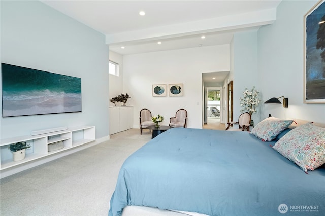 bedroom featuring recessed lighting, multiple windows, beam ceiling, and carpet