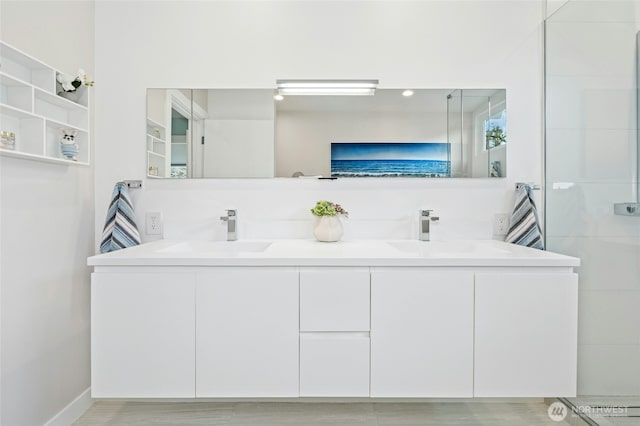 full bath with double vanity and a sink