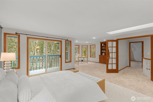 bedroom featuring access to outside, recessed lighting, light colored carpet, and french doors