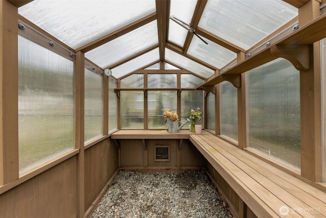 unfurnished sunroom with a sauna and lofted ceiling with beams