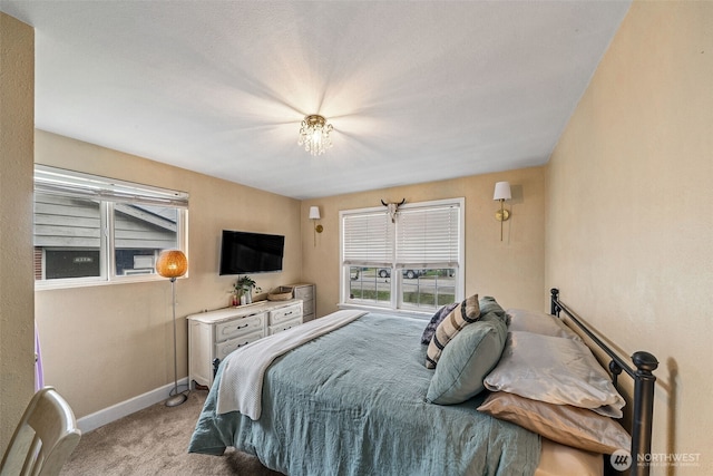 bedroom with carpet and baseboards