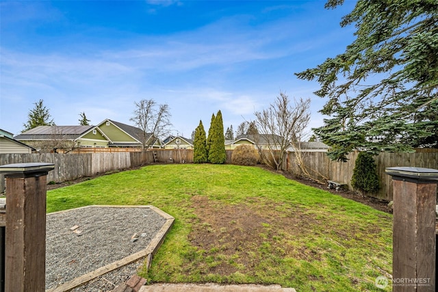 view of yard featuring a fenced backyard