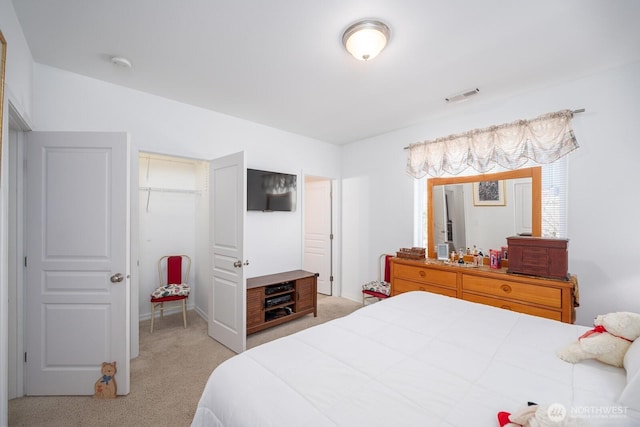 bedroom featuring light colored carpet and visible vents