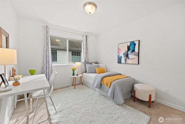 carpeted bedroom with baseboards