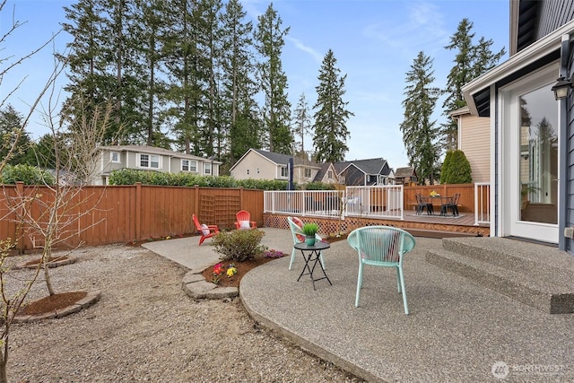 exterior space with a deck and a fenced backyard