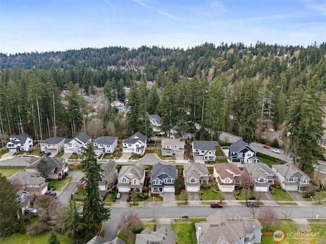 bird's eye view with a forest view and a residential view