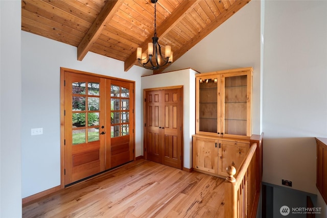 6065 Central Ave, Anacortes, WA 98221 - foyer entrance with wooden ceiling, light wood-type flooring, a chandelier, french doors, and vaulted ceiling with beams
