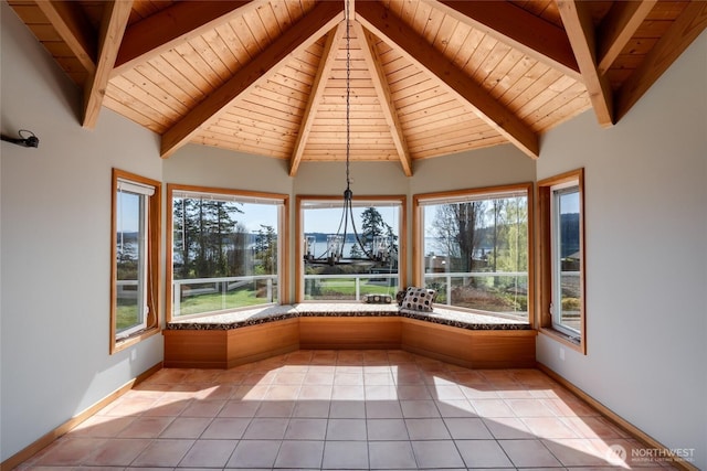 6065 Central Ave, Anacortes, WA 98221 - unfurnished sunroom with a wealth of natural light, tile patterned floors, and lofted ceiling with beams
