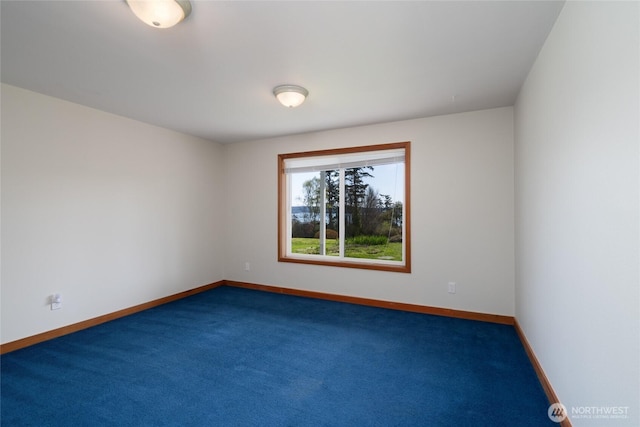 6065 Central Ave, Anacortes, WA 98221 - empty room with carpet flooring and baseboards