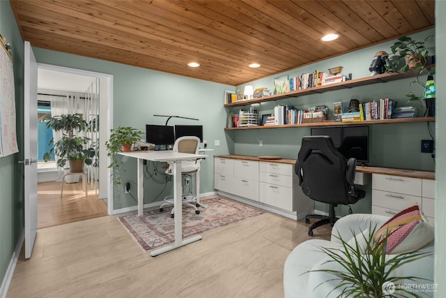 office area with recessed lighting, light wood-type flooring, wooden ceiling, and built in desk