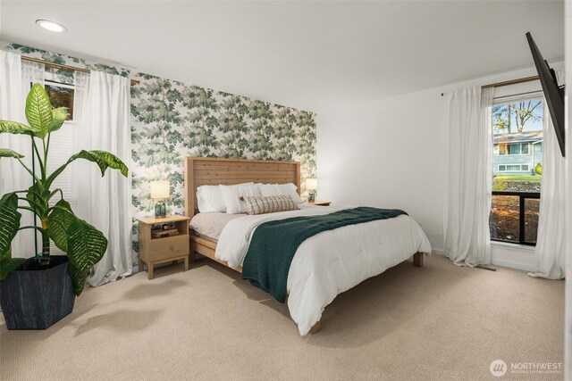 bedroom featuring recessed lighting, baseboards, light carpet, and wallpapered walls