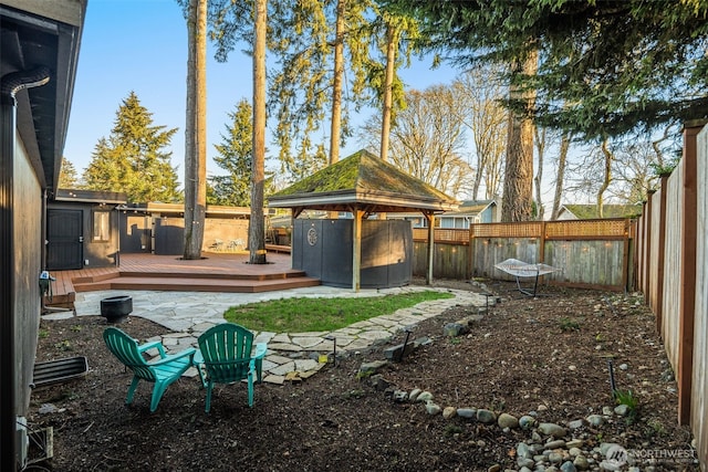 view of yard featuring a wooden deck and a fenced backyard