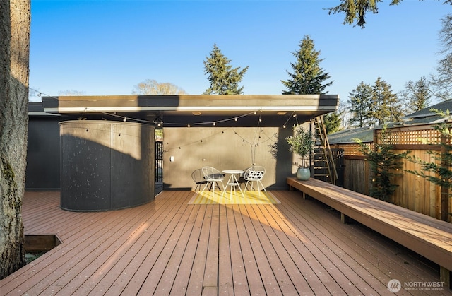 wooden deck featuring fence