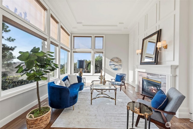 sunroom / solarium with a fireplace