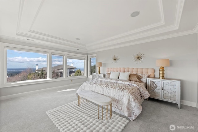 bedroom with a raised ceiling, baseboards, carpet floors, and ornamental molding