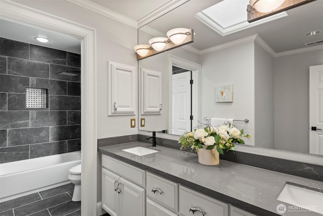 full bathroom featuring crown molding, toilet, visible vents, and a sink