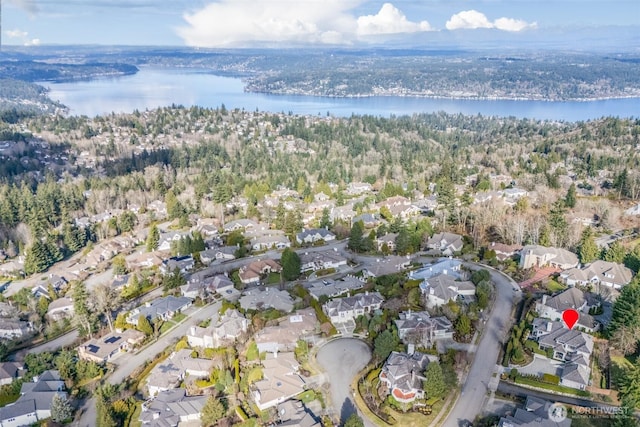 drone / aerial view with a residential view and a water view